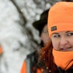 Hunters Hunting in winter wearing blaze orange hunting clothing