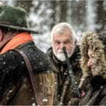 Hunters Hunting in winter wearing blaze orange hunting clothing
