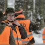 Hunters Hunting in winter wearing blaze orange hunting clothing