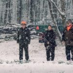 Hunters Hunting in winter wearing blaze orange hunting caps