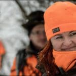 Hunter Hunting in Blaze Orange Camo Hunting Clothing