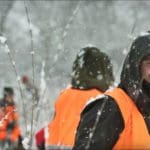 Hunter Hunting in Blaze Orange Camo Hunting Clothing