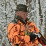 Hunter Hunting in Blaze Orange Camo Hunting Clothing