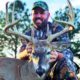 Happy and Successful Deer Hunter with Trophy Bow Killed Whitetail Buck Wearing Treezyn Late Seezyn Camo | Hunting Magazine