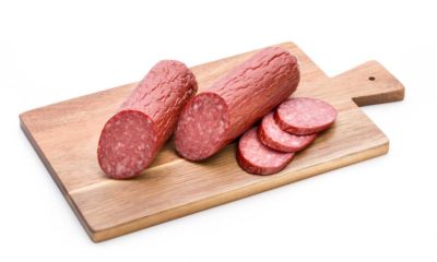 venison summer sausage on wooden cutting board | Hunting Magazine