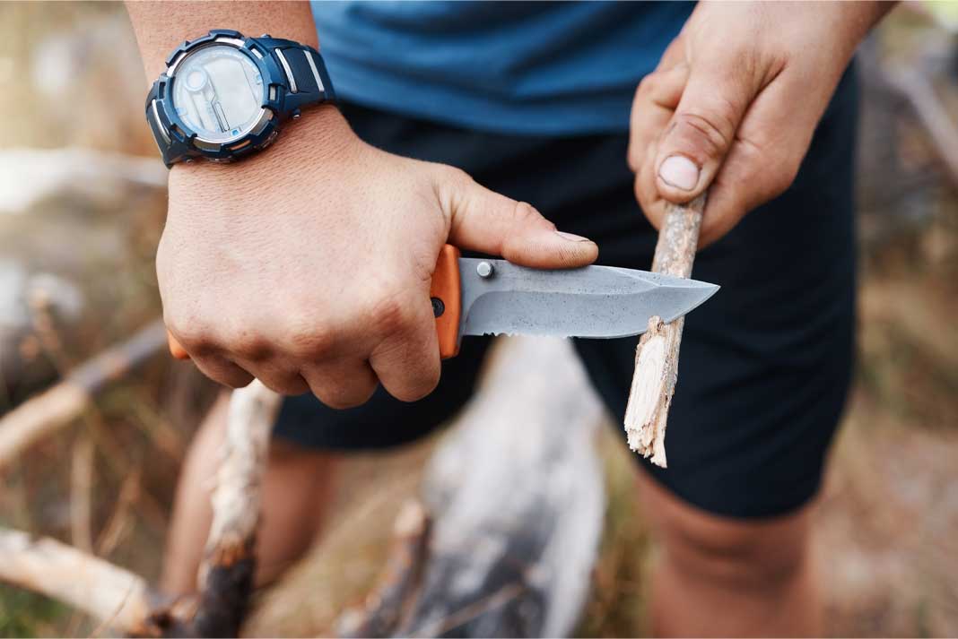 Using knife and carving a stick to use for camping - Hunting Magazine